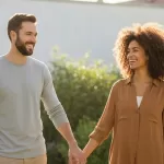 Happy couple in natural setting representing fertility and wellness